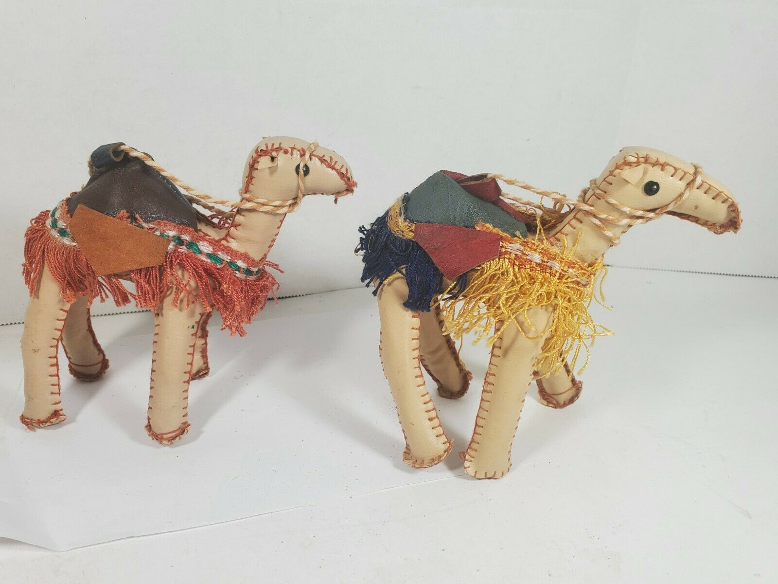 Two Hand-stitched Leather Camels Saddles Fringe 5" X 6"